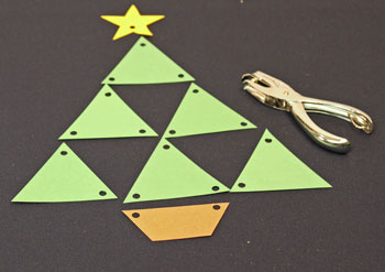 Easy Christmas Crafts Construction Paper Triangles Christmas Tree step 4 punch holes