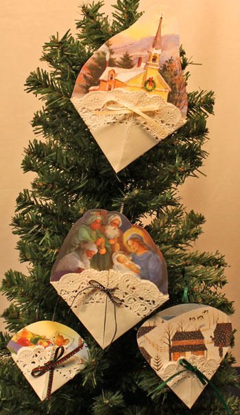 Easy Christmas Crafts Paper Doily Greeting Card Ornament four finished hanging on tree