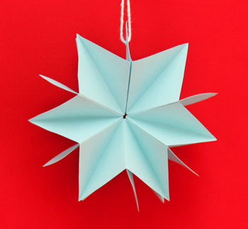 Folded Paper Squares Star blue 6 point on display
