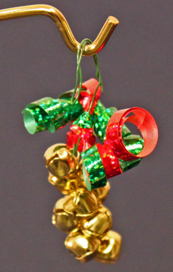 Easy Christmas Crafts Bell Ornament finished gold, red and green hanging on stand