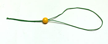 Calico Semi Circles Christmas Tree step 3 thread yarn through bead