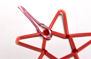 Chenille Wire and Straw Star step 18 insert ribbon ends through loop