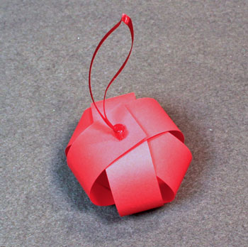 Christmas ornaments paper sphere step 11 double knot ribbon on top