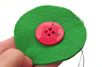 Easy Christmas Crafts Button Wreath Ornament step 2 sew button to center of two circles