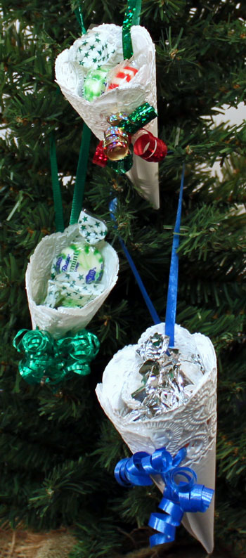 Easy Christmas Crafts Paper Doily Cone Ornament three finished hanging on tree