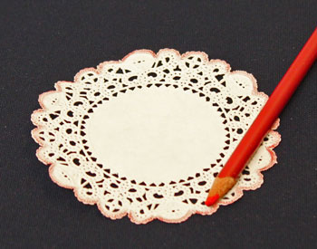 Easy Christmas Crafts Paper Doily Folded Christmas Tree Ornament step 1 color around the doily edge