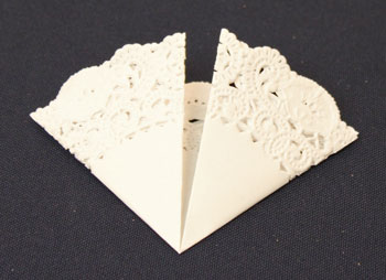 Easy Christmas Crafts Paper Doily Greeting Card Ornament step 2 fold doily into arc