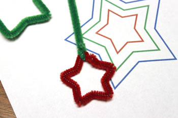 Easy Christmas Crafts Three Stars Chenille Ornament step 10 attach short green wire to top of red star