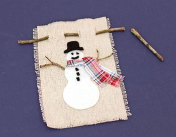 Easy Christmas Crafts Felt and Twig Snowman step 11 insert twig hanger