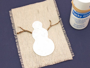 Easy Christmas Crafts Felt and Twig Snowman step 6 glue snowman and twig arms
