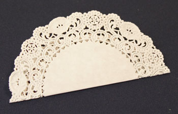 Easy Christmas Crafts Paper Doily Flower Ornament step 1 fold doily in half