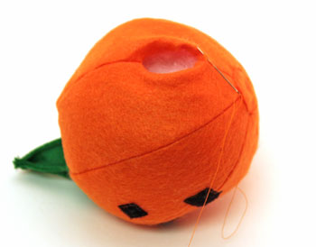Easy Felt Crafts Emoti-Pumpkin step 17 sew opening together over stuffing