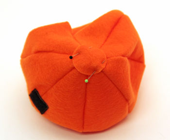 Easy Felt Crafts Emoti-Pumpkin step 9 pin circle to bottom of pumpkin