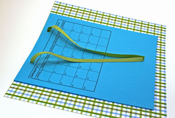 Easy paper crafts pocket calendar step 5 insert ribbon through holes