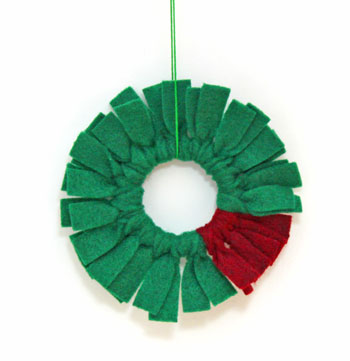 Felt Fringe Wreath Ornament dark green and dark red on display