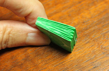 Folded Paper Squares Star step 11 glued stack of squares
