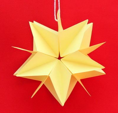 Folded Paper Squares Star yellow 5 point on display