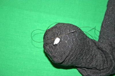 Frugal-Fun-Crafts-Mending-Socks-with-light-bulbs-trouser-sock-hole-with-bulb-small-stitches