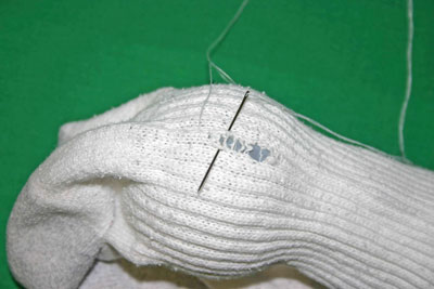 Frugal-Fun-Crafts-Mending-Socks-with-light-bulbs-white-sock-back-hole-start-mending