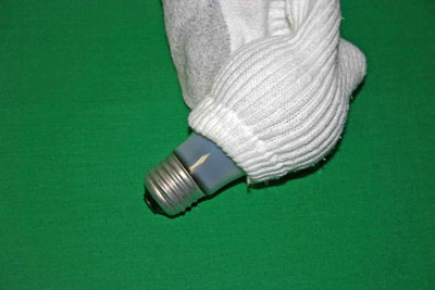 Frugal-Fun-Crafts-Mending-Socks-with-light-bulbs-white-sock-insert-light-bulb