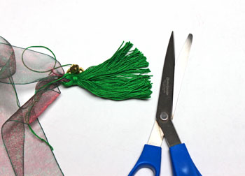 Ribbon and Bell Tassel Ornament step 16 cut yarn loops