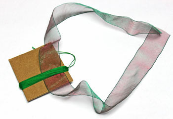 Ribbon and Bell Tassel Ornament step 9 insert ribbon