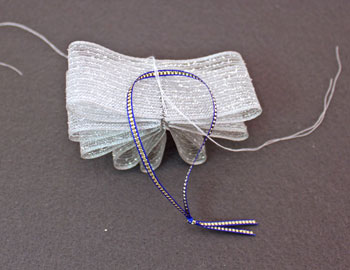 Ribbon Flower Ornament step 8 tie threads through ribbon loop