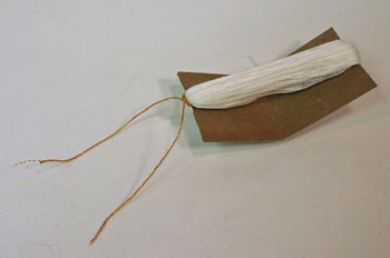 Easy Angel Crafts - Yarn Angel - Tie gold yarn around white yarn at one end