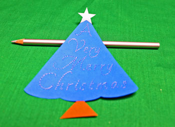 A Very Merry Christmas Tree step 7 outline each letter with colored pencil