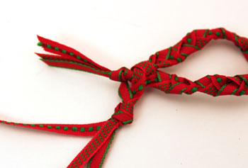 Braided ribbon wreath ornament step 7 insert beginning knot through braid