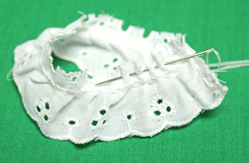 Button and Lace Ornament step 4 make running stitches along the edge.