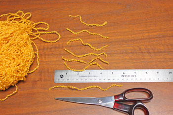 Cardstock and Doily Angel step 10 cut yarn pieces