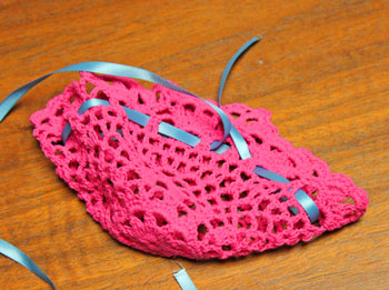 Crocheted Doily Wrapped Ornament step 3 finish weaving ribbon