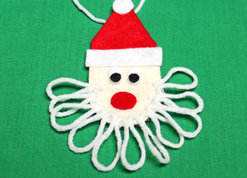 Easy Felt Santa Claus Ornament step 13 cut yarn at end of first layer