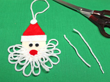 Easy Felt Santa Claus Ornament step 15 cut yarn for mustache