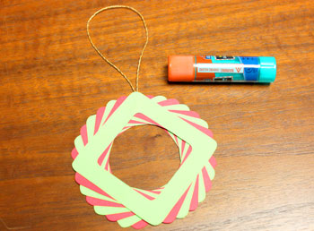 Eight Squares Wreath Ornament step 10 glue yarn loop