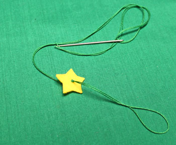 Felt Stars Christmas Tree step 3 needle through star and tie knot