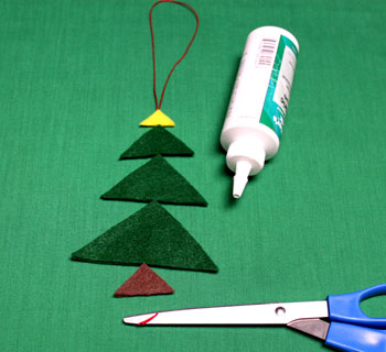 Felt Triangles Christmas Tree step 5 trim yarn ends below brown triangle