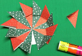 Fold Paper Spiral Bow step 8 continue gluing