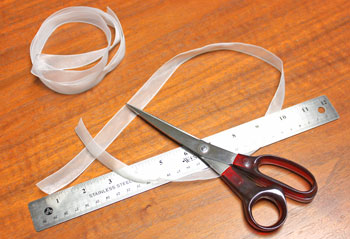 Folded Square Paper Angel step 12 cut ribbon