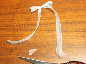 Folded Square Paper Angel step 13 make bow