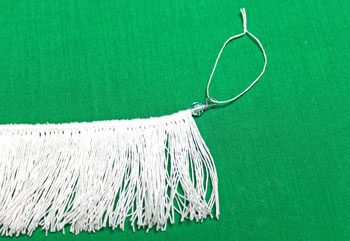 Fringed Yarn Ornament step 12 add yarn for hanging loop