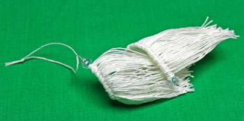 Fringed Yarn Ornament step 13 form yarn covered wire into gentle spiral
