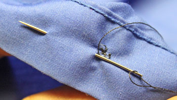 How to sew on a button step 14 hiding end thread