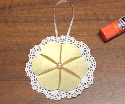 Paper Circles Triangle Doily Ornament step 9 glue bead to center of circles