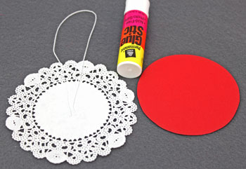 Paper Doily Snowflake Ornament step 2 position yarn