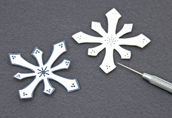 Paper Doily Snowflake Ornament step 5 pinhole punch snowflake