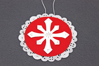 Paper Doily Snowflake Ornament step 6 glue snowflake to circle