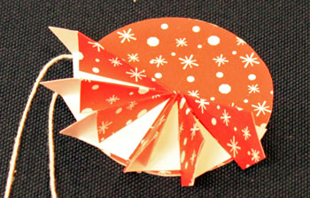 Easy Christmas Crafts Paper Pinwheel Wreath Ornament step 14 second quadrant finished