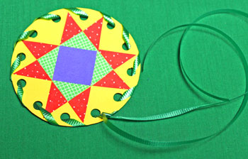 Paper Quilt Patch Ornament step 12 secure first ribbon